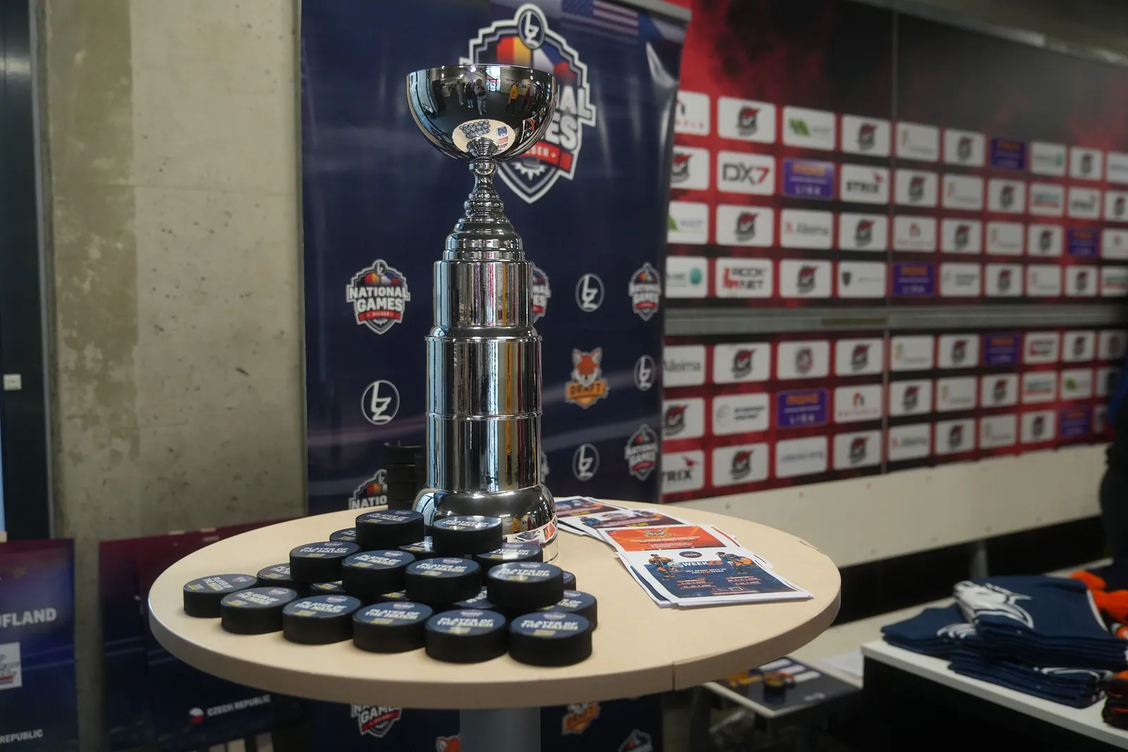 The trophy and Player of the Match pucks