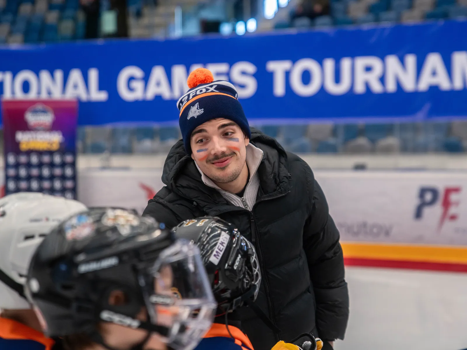Coach with a player by the bench